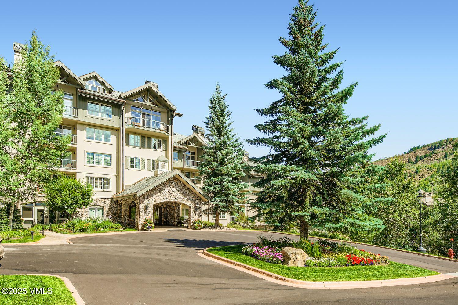 1120 Village Road, Unit 204 Beaver Creek, CO 81620 - Photo 28 of 29 a front view of a house with a yard