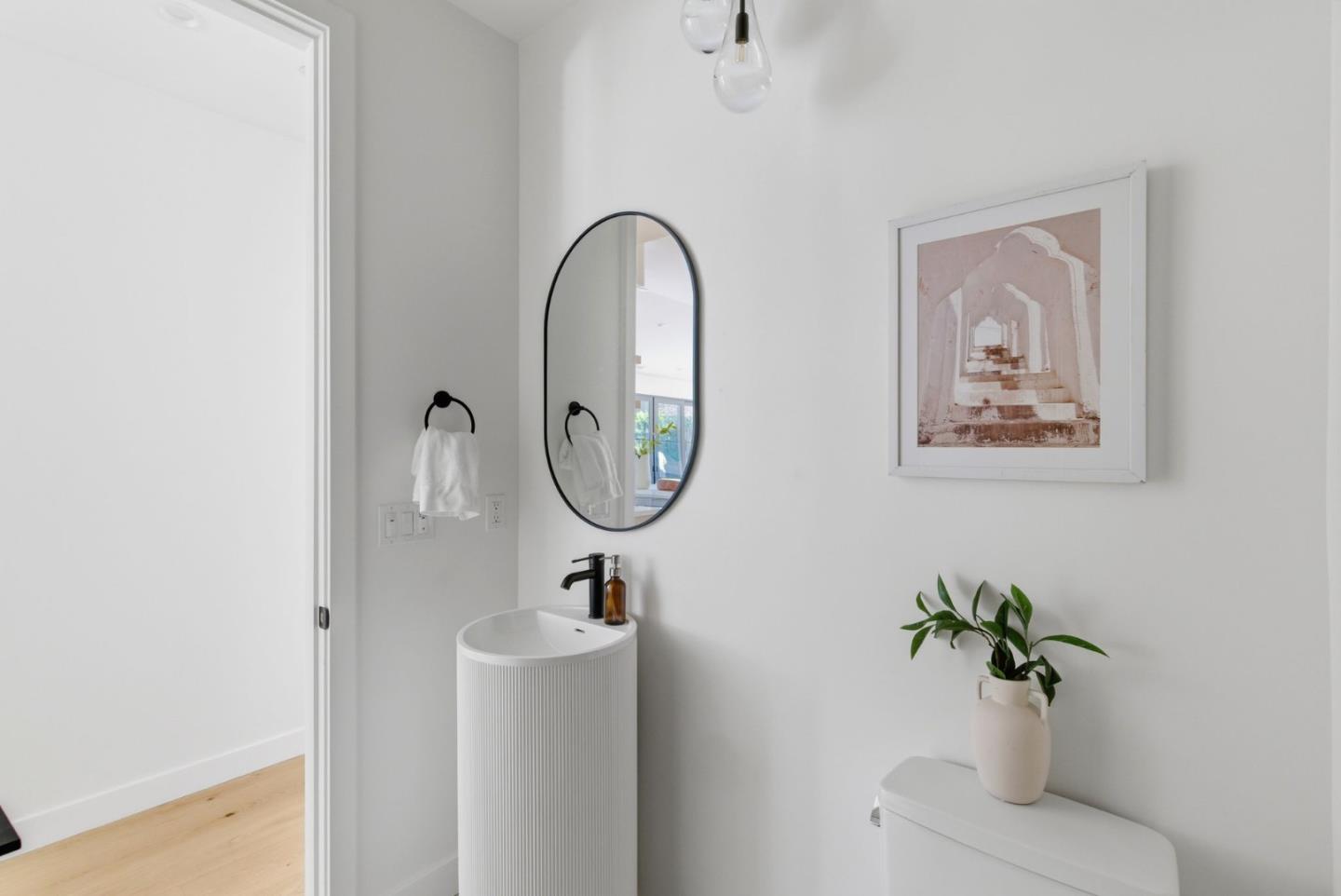 680 North San Antonio Road Los Altos, CA 94022 - Photo 18 of 19 a bathroom with a sink mirror and vanity