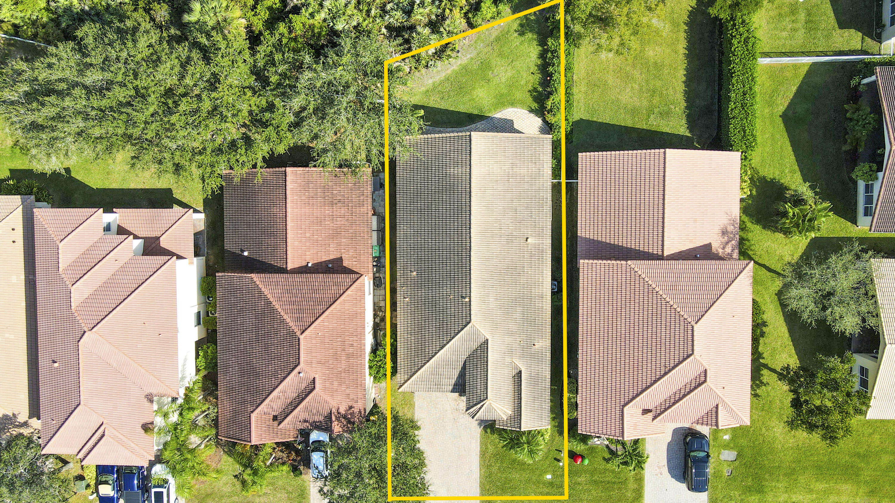 an aerial view of a house with a yard and fountain