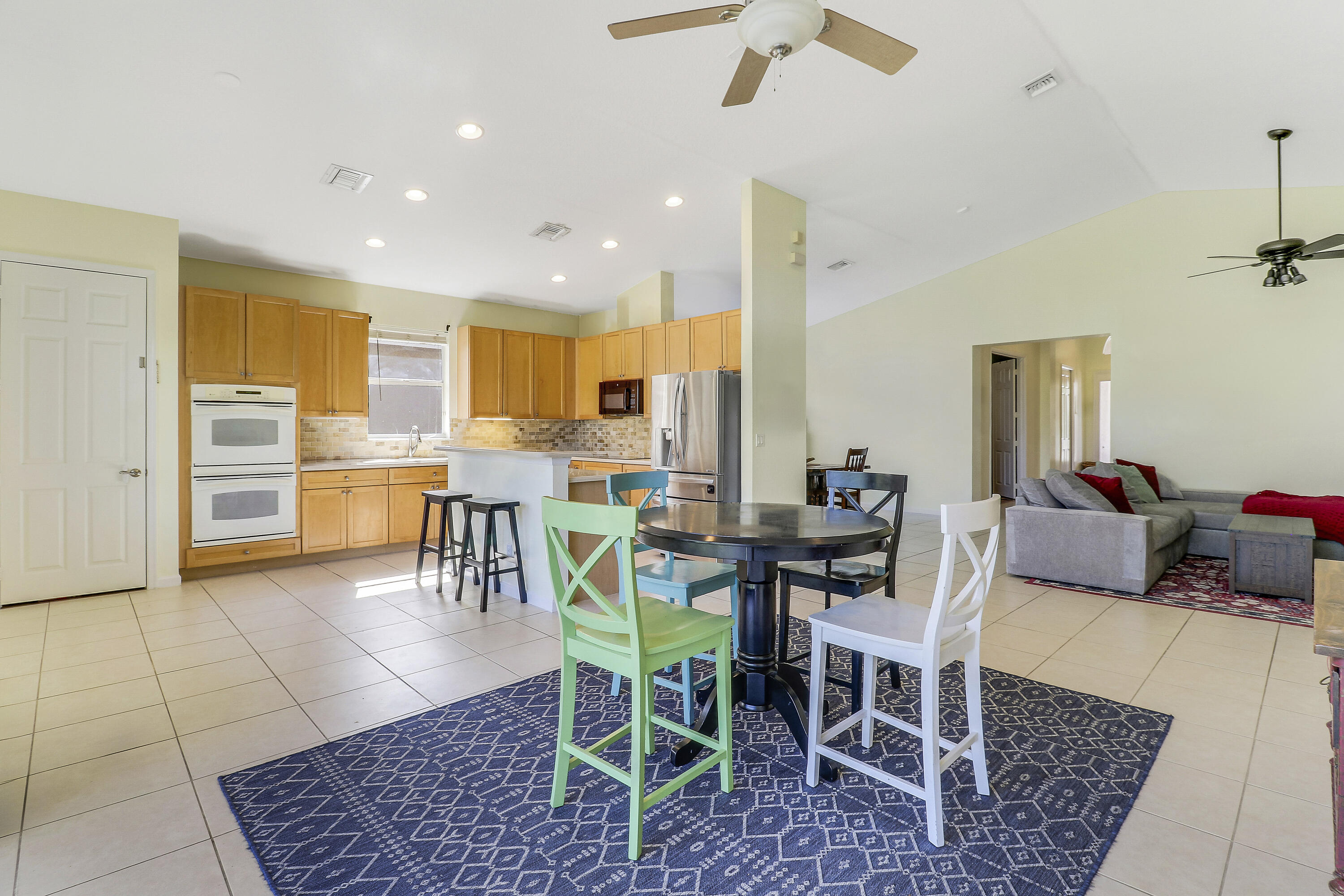 5017 Southeast Graham Drive Stuart, FL 34997 - Photo 16 of 38 a view of a dining room with furniture