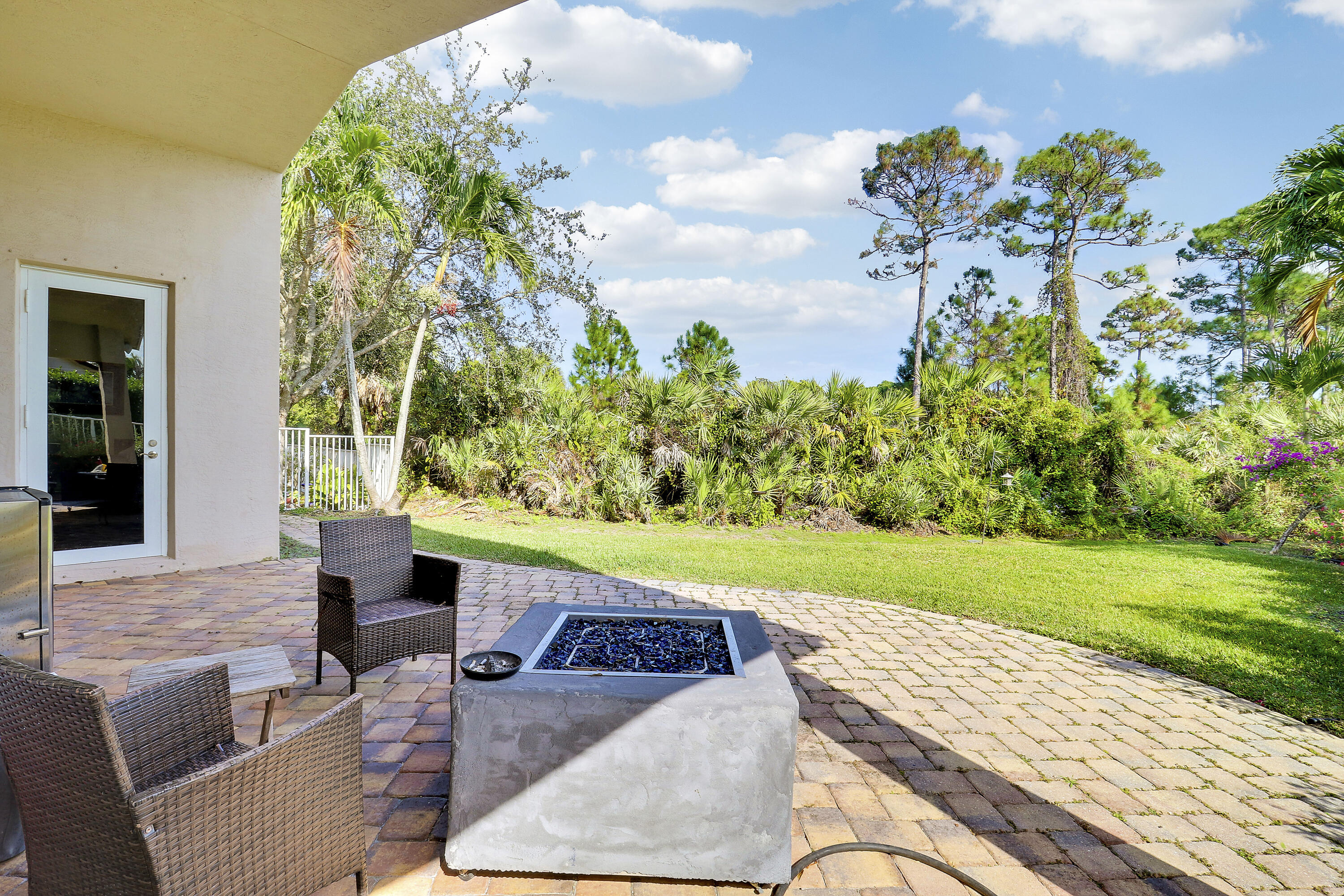 5017 Southeast Graham Drive Stuart, FL 34997 - Photo 29 of 38 a view of a backyard with plants and a patio