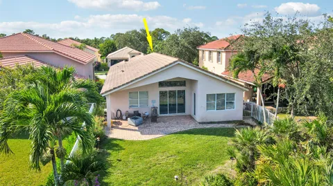 a front view of house with yard and outdoor seating