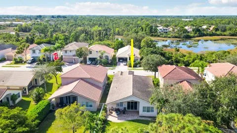 an aerial view of multiple houses with yard