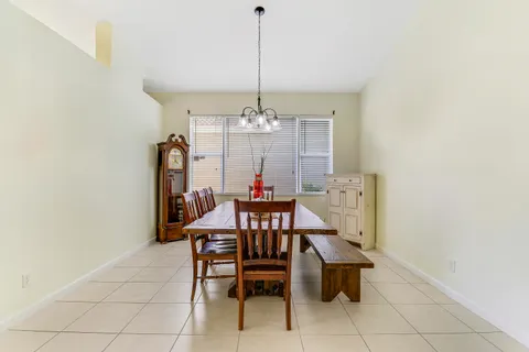 a view of a dining room with furniture and window