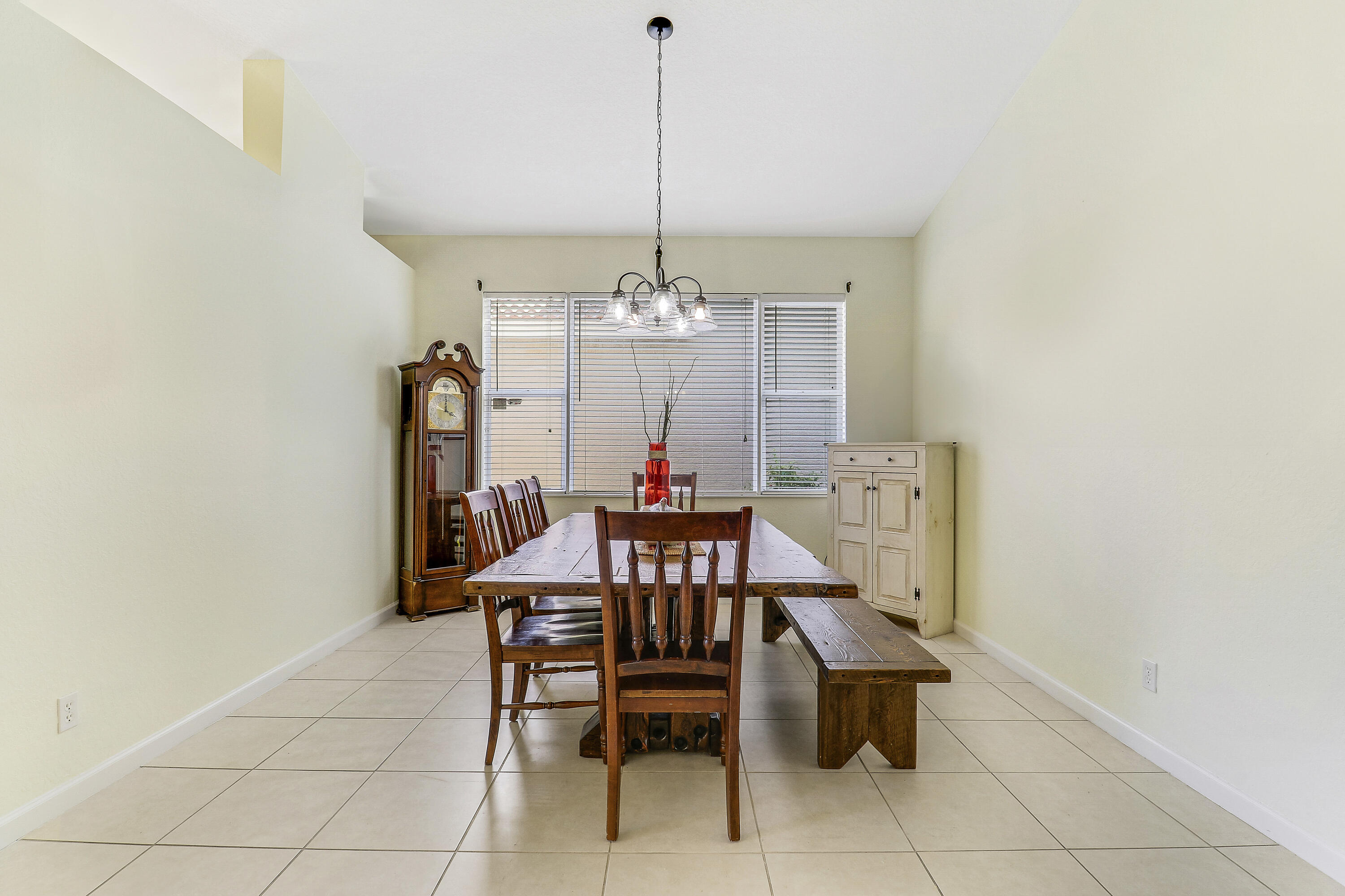 5017 Southeast Graham Drive Stuart, FL 34997 - Photo 6 of 38 a view of a dining room with furniture and window