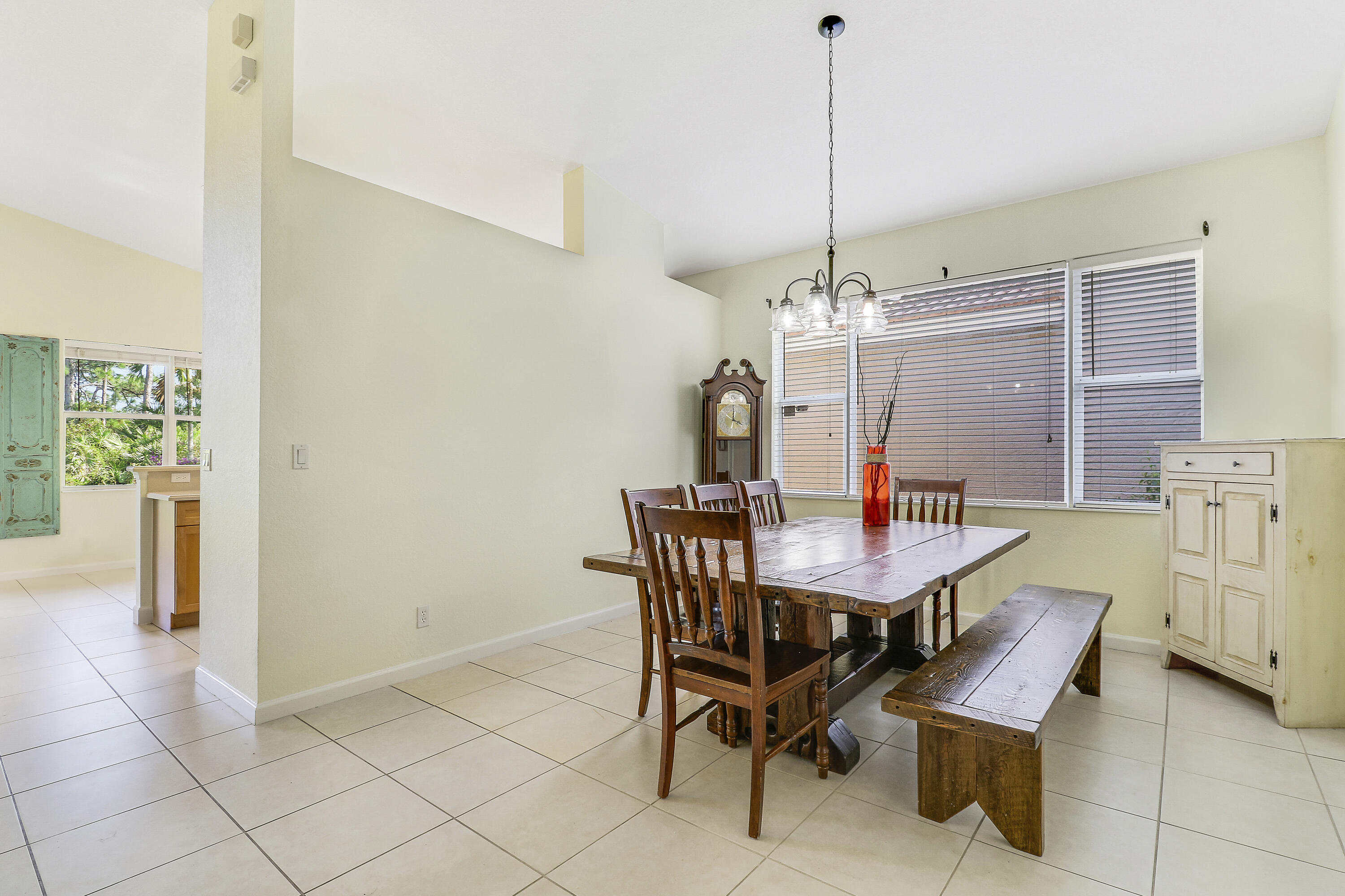 5017 Southeast Graham Drive Stuart, FL 34997 - Photo 7 of 38 a view of a dining room with furniture and chandelier