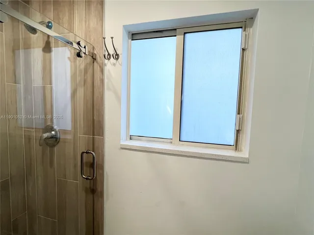 a bathroom with a toilet a sink and a mirror