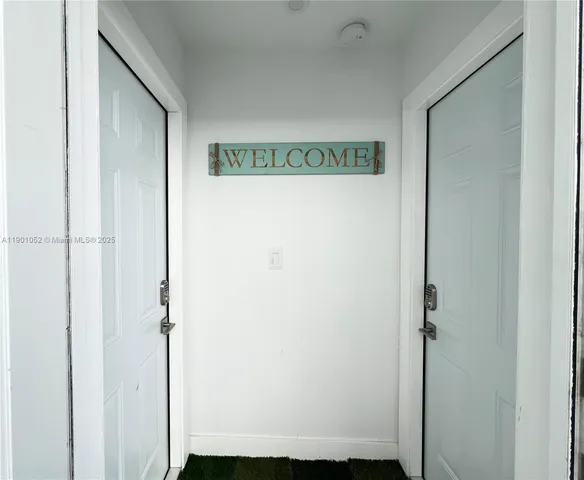 a kitchen with appliances a sink and cabinets