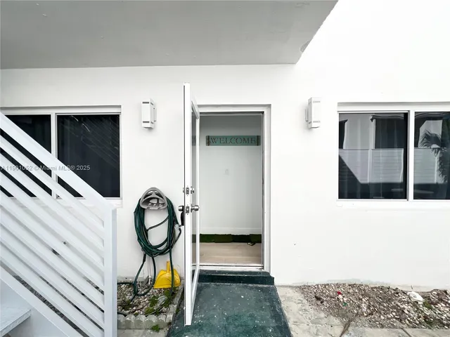 a large bedroom with a bed and furniture