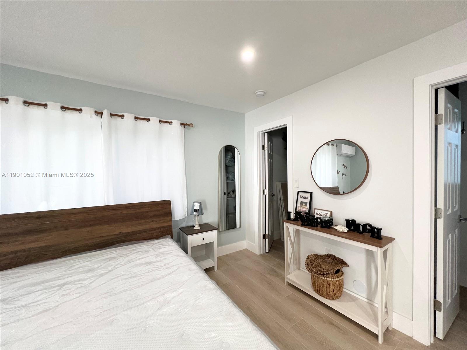 312 Elm Street Hollywood, FL 33019 - Photo 38 of 52 a spacious bathroom with a mirror and a sink