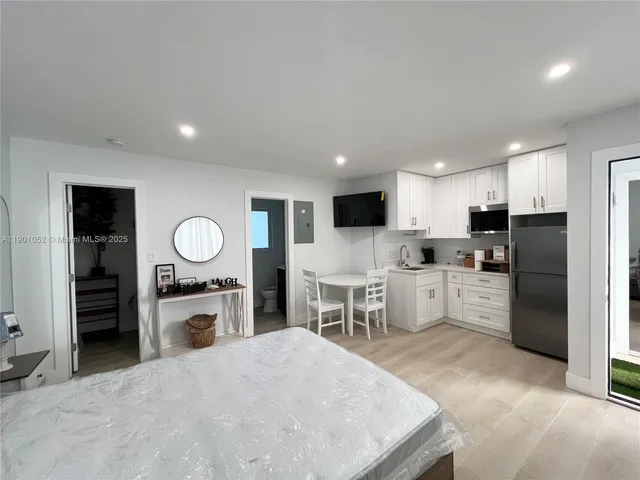 a bathroom with a shower and a sink