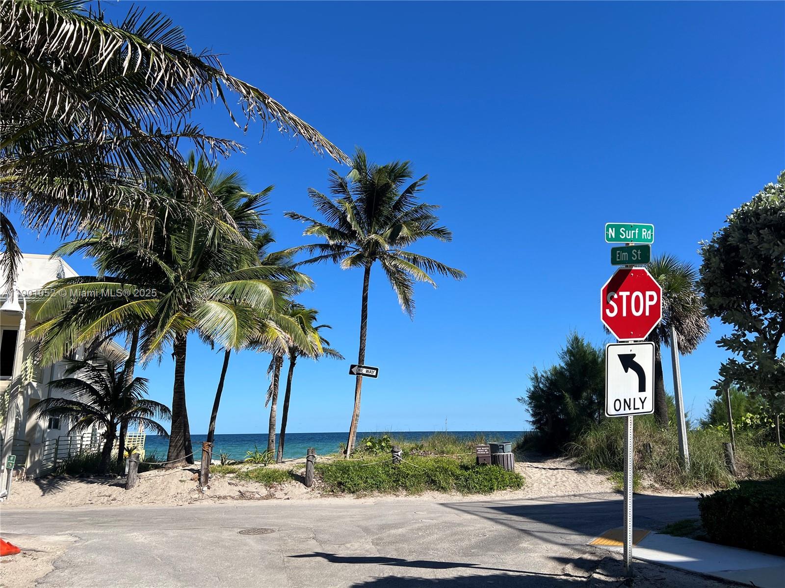 312 Elm Street Hollywood, FL 33019 - Photo 4 of 52 a view of a street with a building and a street sign