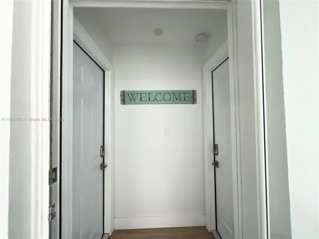 a view of entryway with a front door