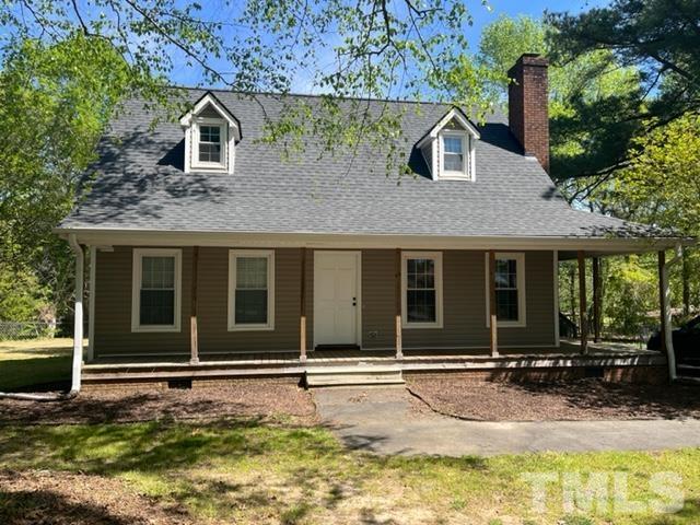 3590 Sanders Road Willow Spring, NC 27592 - Photo 1 of 6 a front view of a house with a yard