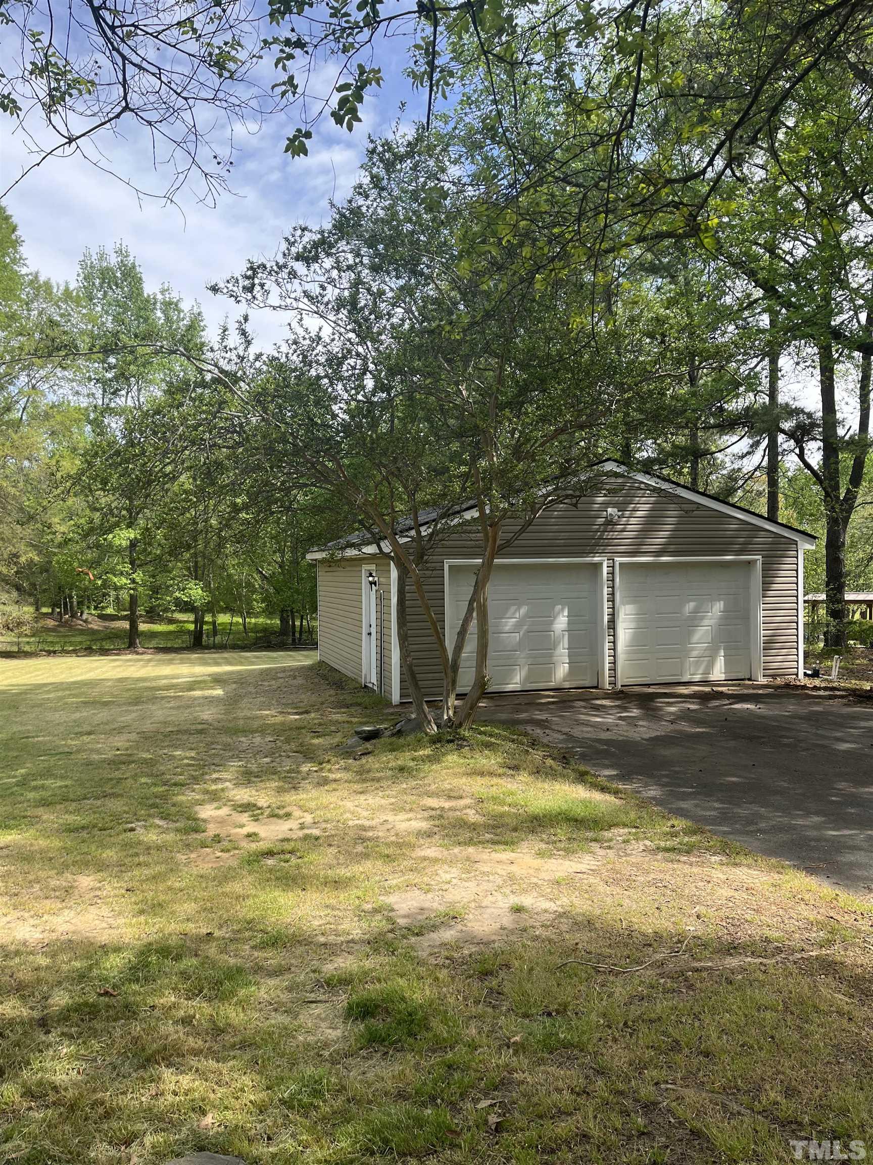 3590 Sanders Road Willow Spring, NC 27592 - Photo 5 of 6 a view of a house with a yard