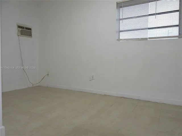 a bathroom with a picture on the wall