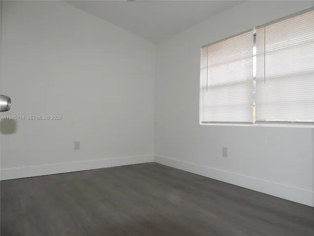 a close up of a sink and a washer and dryer