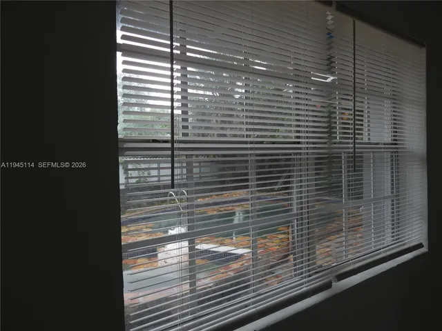 a view of a backyard of the house