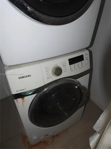 a view of an empty room and a window