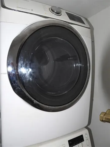 an empty room with a kitchen