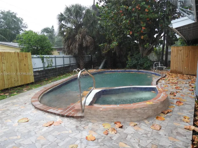 an empty room with a mirror