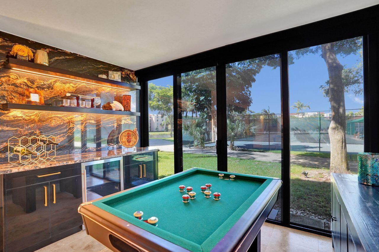 755 Dotterel Road, Unit 1112 Delray Beach, FL 33444 - Photo 14 of 59 a room with pool table and windows