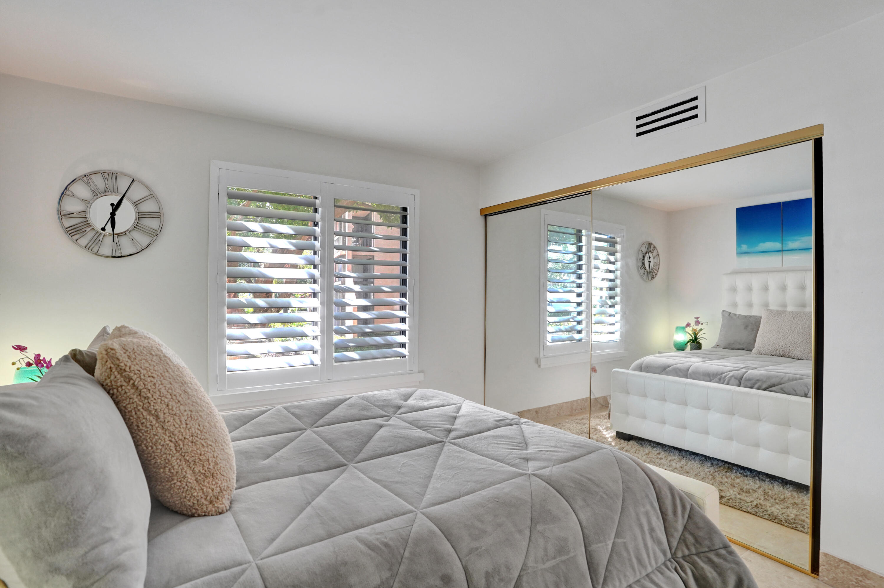 755 Dotterel Road, Unit 1112 Delray Beach, FL 33444 - Photo 29 of 59 a bedroom with a bed and a window