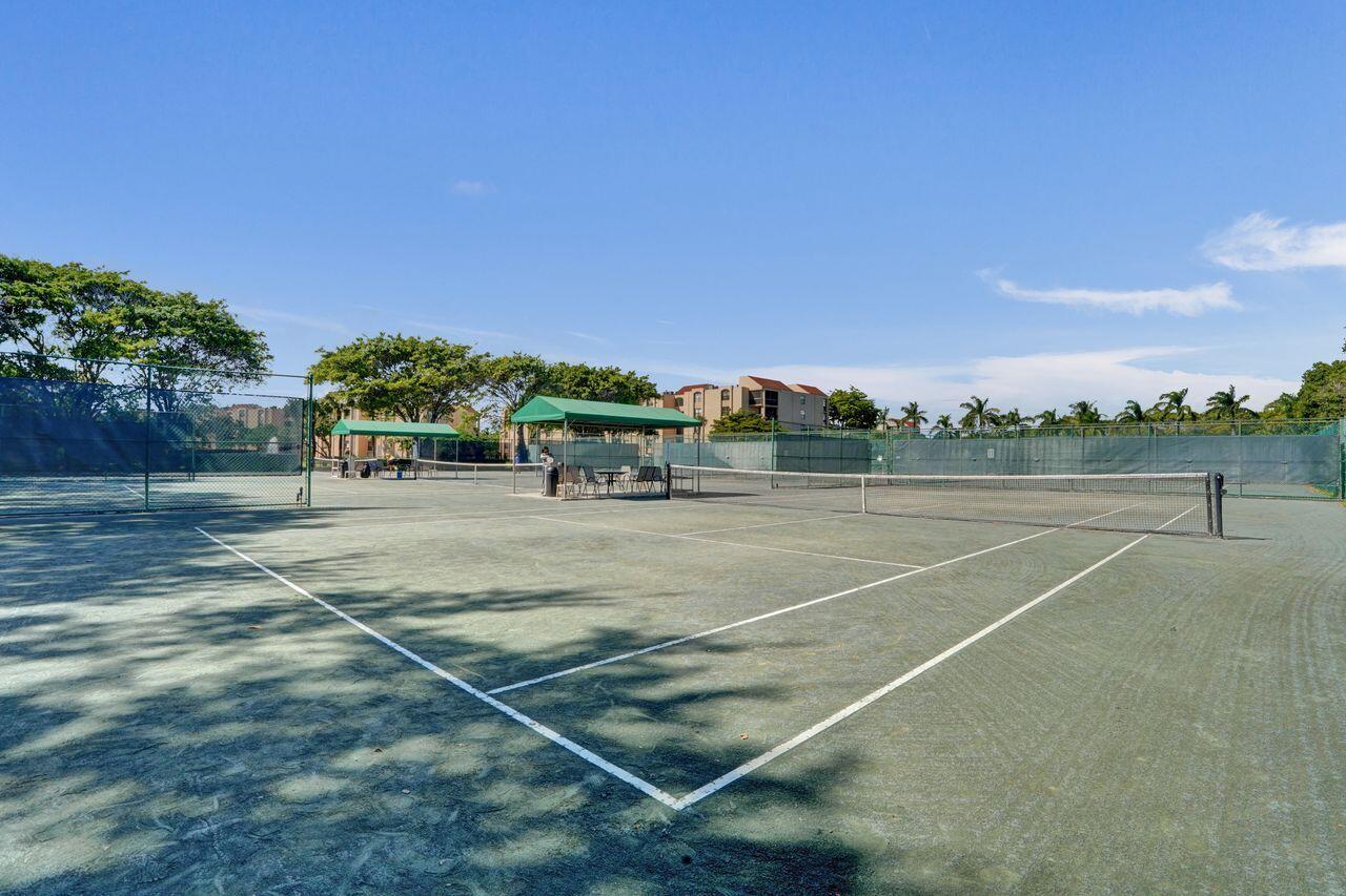 755 Dotterel Road, Unit 1112 Delray Beach, FL 33444 - Photo 44 of 59 a view of a tennis court
