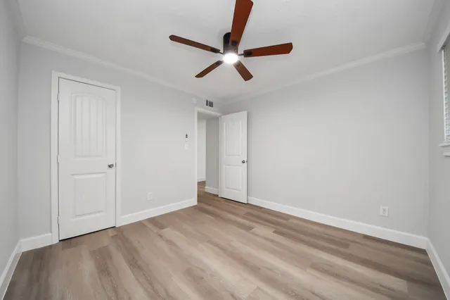 a bathroom with a sink a toilet a mirror and shower