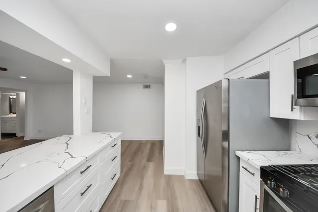 a large bathroom with a double vanity sink and a mirror