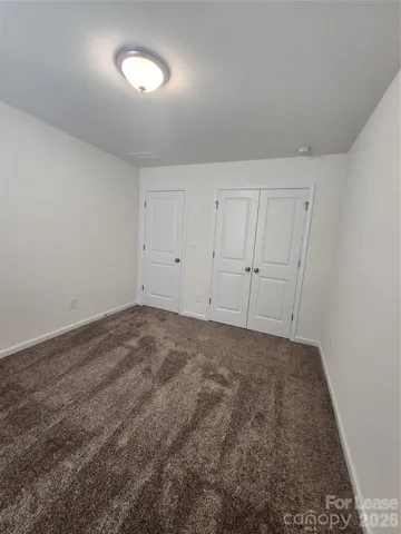 an empty room with a empty space and windows