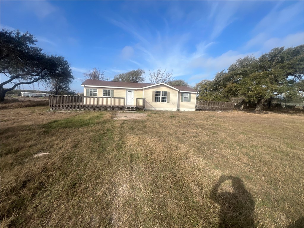 615 Monkey Road Rockport, TX 78382 - Photo 3 of 15 a front view of a house with a yard