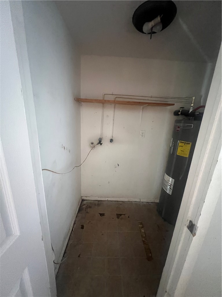 615 Monkey Road Rockport, TX 78382 - Photo 6 of 15 a view of storage and utility room with a washer dryer