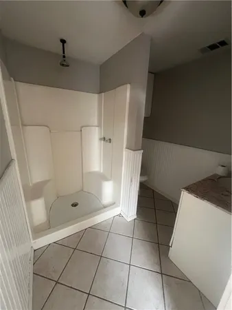a view of an empty room and a window