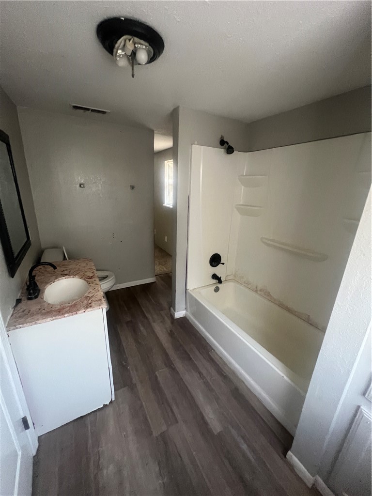 615 Monkey Road Rockport, TX 78382 - Photo 10 of 15 a bathroom with a tub sink and toilet