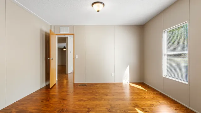 a view of an empty room and window