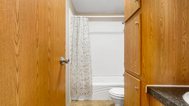 a bathroom with a shower curtain