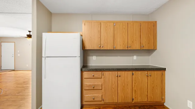 a view of cabinets with wooden floor