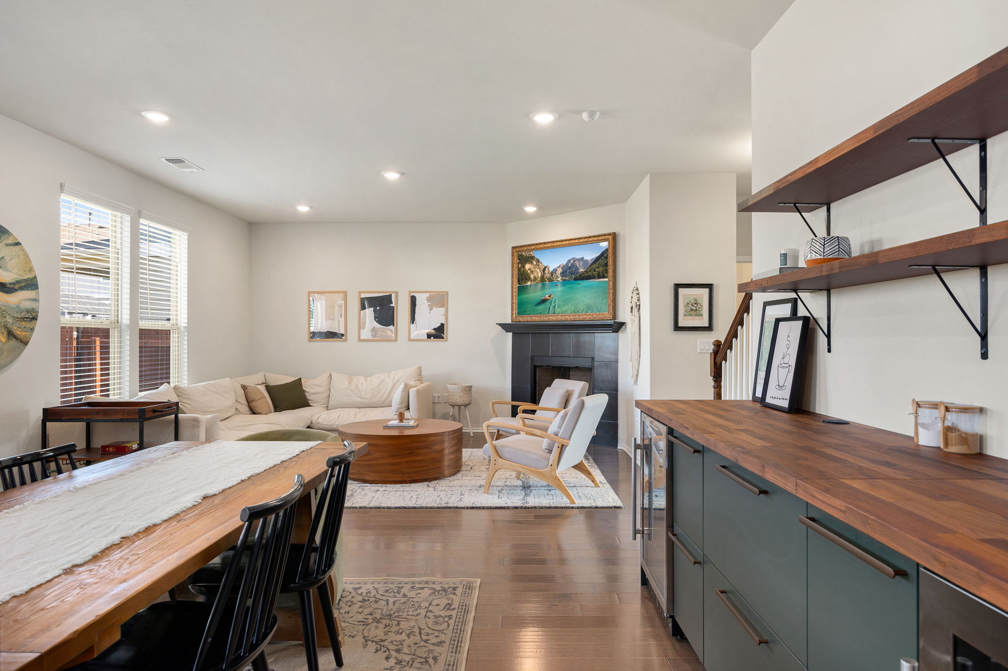 6808 Ellsworth Walk Austin, TX 78724 - Photo 12 of 40 a living room with furniture a large window and wooden floor