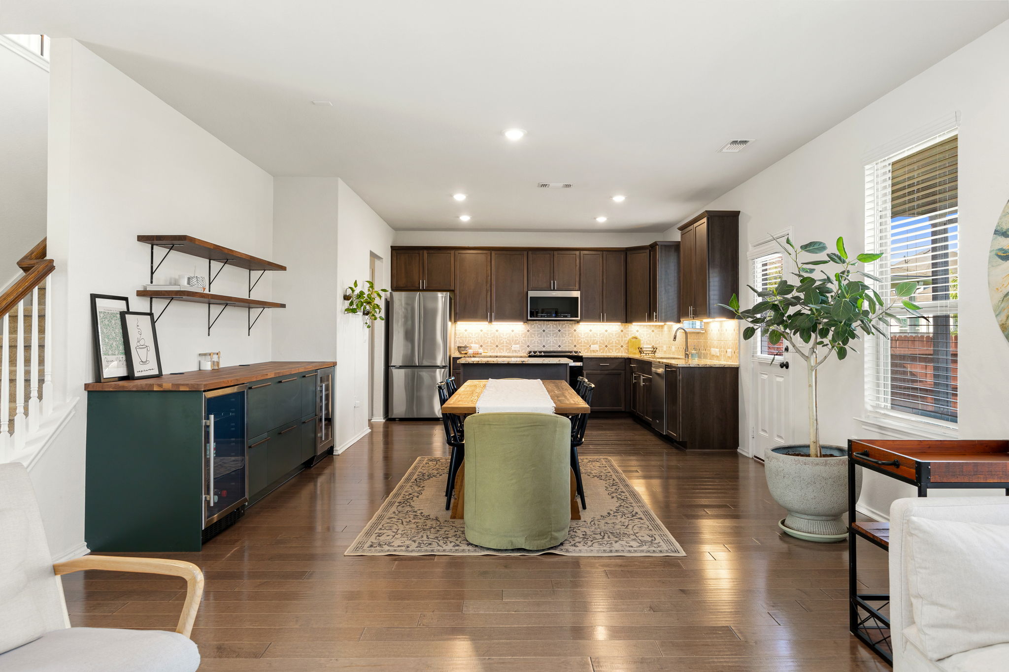6808 Ellsworth Walk Austin, TX 78724 - Photo 13 of 40 a living room with furniture and a dining table with wooden floor