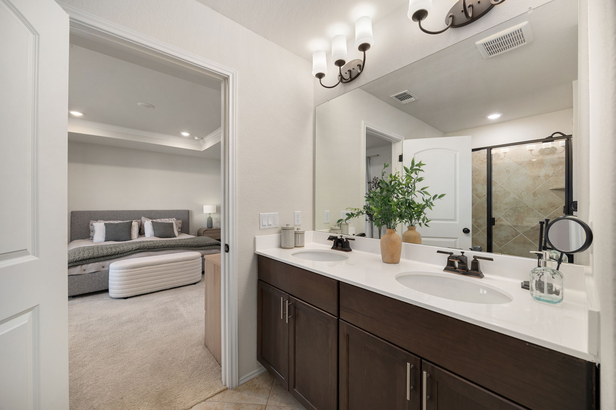 6808 Ellsworth Walk Austin, TX 78724 - Photo 22 of 40 a bathroom with a sink double vanity granite and a mirror