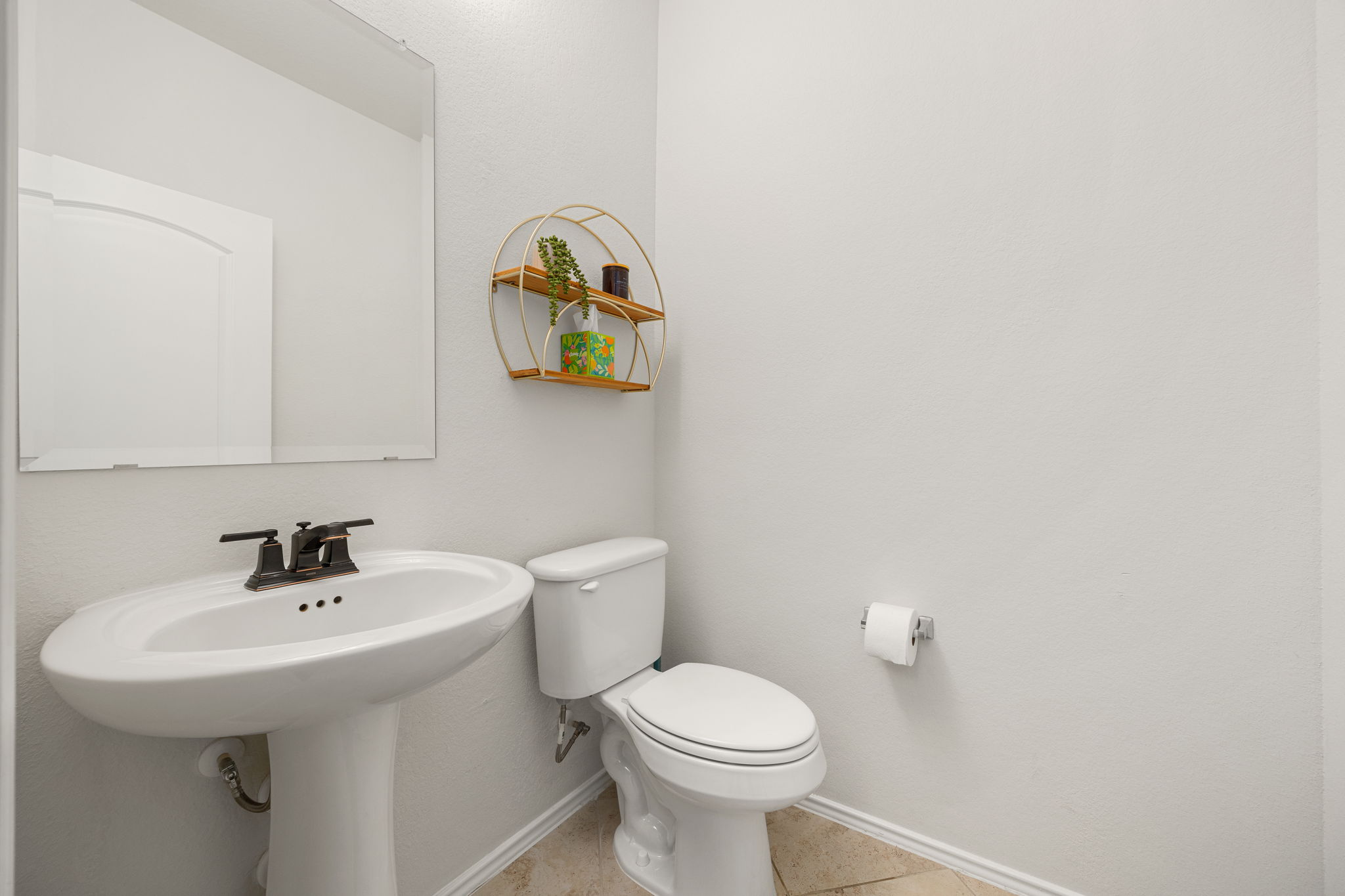 6808 Ellsworth Walk Austin, TX 78724 - Photo 29 of 40 a bathroom with a sink and a toilet