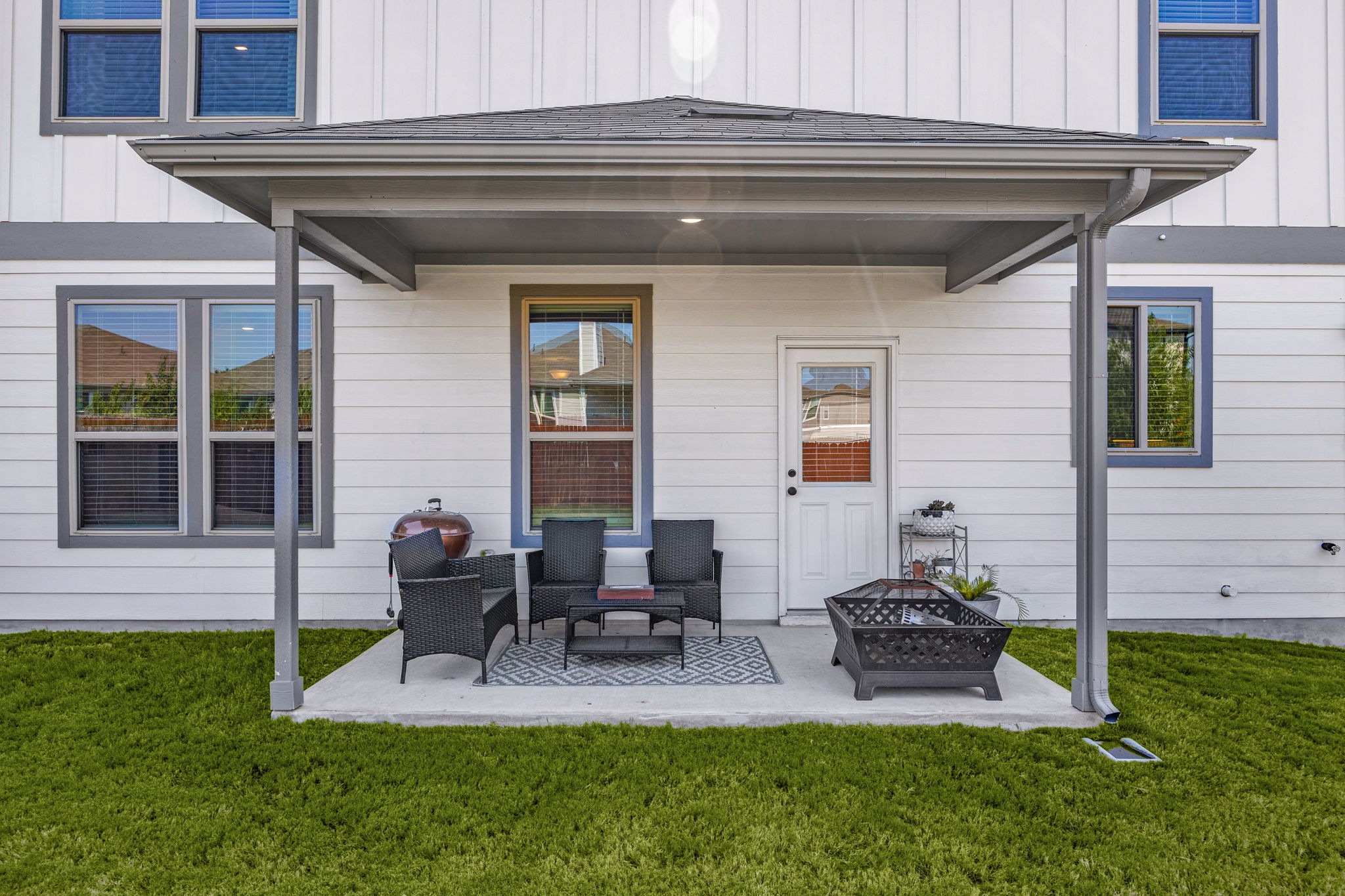 6808 Ellsworth Walk Austin, TX 78724 - Photo 32 of 40 a view of backyard of house with outdoor seating and green space