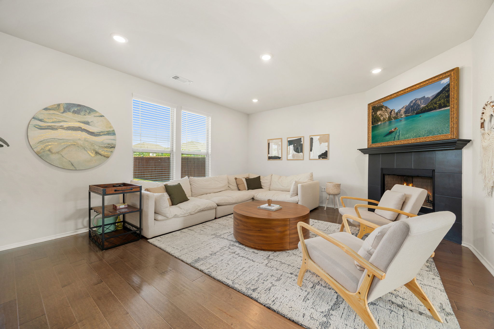 6808 Ellsworth Walk Austin, TX 78724 - Photo 6 of 40 a living room with fireplace furniture and a large window
