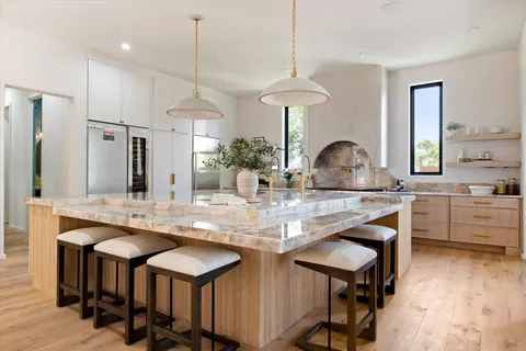 a hallway with a large window and fire place