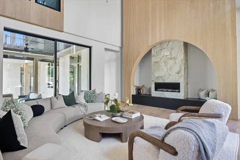 a kitchen with a stove a sink and cabinets