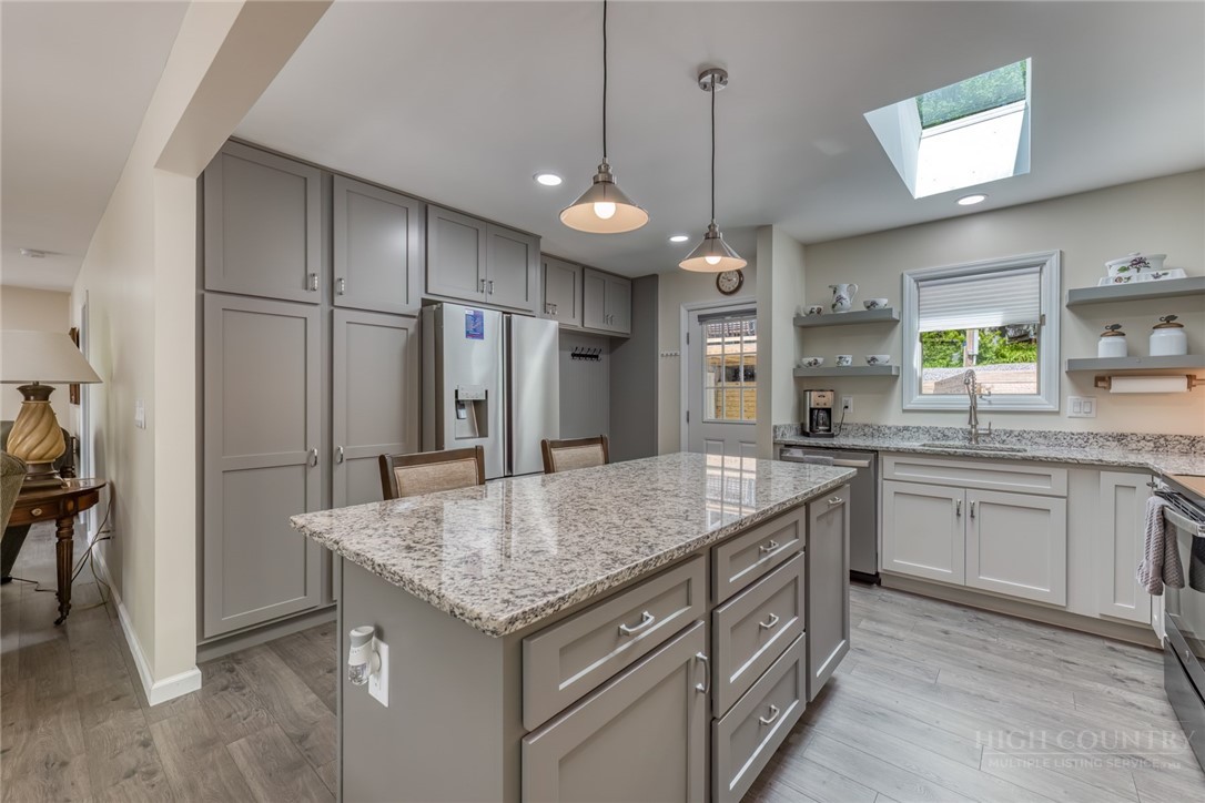 174 Spruce Pine Road Newland, NC 28657 - Photo 8 of 50 a kitchen with stainless steel appliances granite countertop stove a refrigerator and a sink