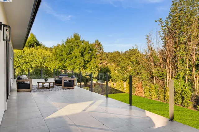 a bathroom with a tub sink and white cabinets