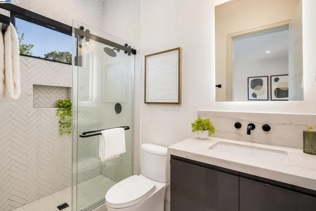 a spacious bedroom with a large bed and a large window