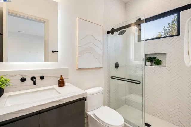 a bathroom with a white bath tub and shower
